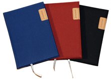red, blue and black hardcover nylon journals with leather tags